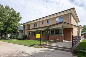 Denver apartment for rent - a building with a yellow sign in front of it