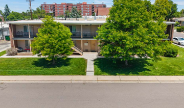 Denver apartment for rent - Apartment complex with two trees in front.