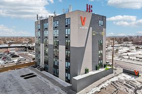 Denver apartment for rent - A large building with a V on the side and the word "VIEWERN" on the front.