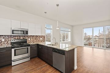Denver apartment for rent - A kitchen with a stove, oven, microwave, and dishwasher.