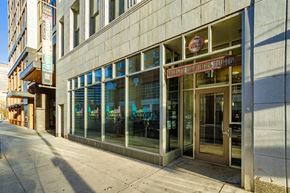 Denver apartment for rent - A building with a glass door and a sign that says "Denver".