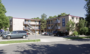 Denver apartment for rent - an apartment building with cars parked in a parking lot
