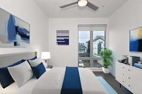 Denver apartment for rent - a bedroom with a bed and a ceiling fan
