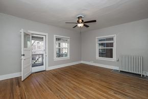 Denver apartment for rent - A room with a ceiling fan and a window.