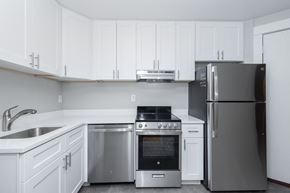 Denver apartment for rent - A modern kitchen with a stainless steel refrigerator, oven, and sink.