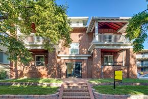 Denver apartment for rent - A red brick building with a sign that says "CALIFORNIA HAUS".