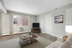 Denver apartment for rent - a living room with a couch and a coffee table and a television