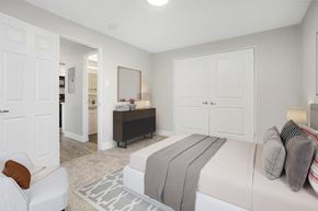 Denver apartment for rent - a bedroom with a large bed and a closet