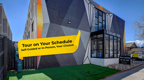 Denver apartment for rent - A building with a sign that says "Tour on Your Schedule! Self-Guided or In-Person, Your Choice!"