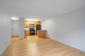 Denver apartment for rent - A kitchen area with a microwave, oven, and refrigerator.