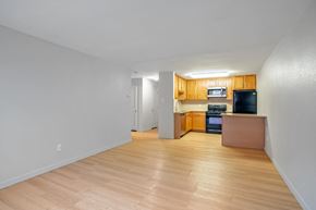 Denver apartment for rent - A kitchen area with a microwave, oven, and refrigerator.