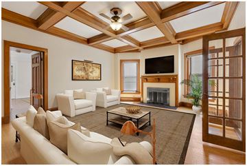 Denver apartment for rent - a living room with white furniture and a fireplace