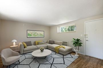 Denver apartment for rent - a living room with a couch and a table