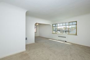 Denver apartment for rent - Empty room with a window and a door.