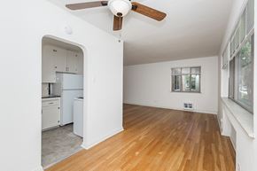 Denver apartment for rent - A room with a ceiling fan and a window.