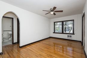 Denver apartment for rent - A room with a ceiling fan and a window.