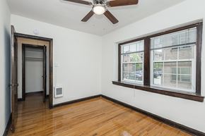 Denver apartment for rent - A room with a ceiling fan and a window with blinds.