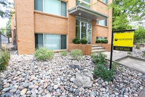 Denver apartment for rent - A building with a yellow sign in front of it.