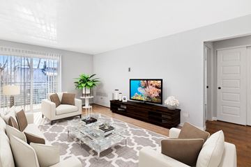 Denver apartment for rent - a living room with white furniture and a flatscreen tv