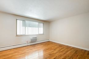 Denver apartment for rent - A room with a window and a fan on the floor.