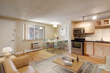 Denver apartment for rent - a living room with a kitchen and a dining table