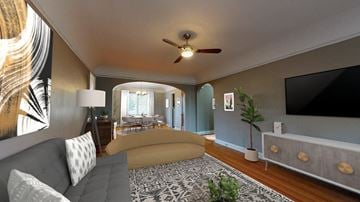 Denver apartment for rent - A living room with a grey couch and a patterned rug.