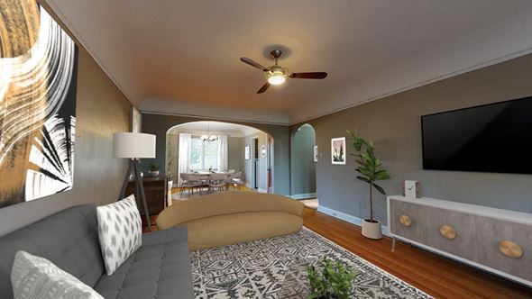 Denver apartment for rent - A living room with a grey couch and a patterned rug.
