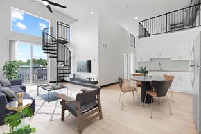 Denver apartment for rent - a living room with a spiral staircase and a dining room and kitchen