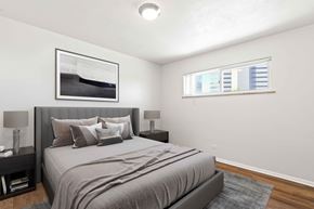 Glendale apartment for rent - a bedroom with a large bed and a window