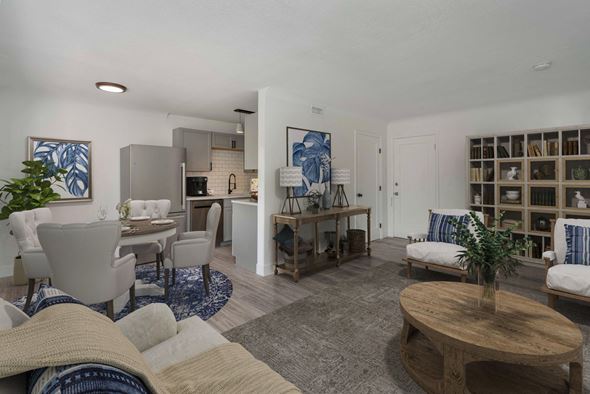 Denver apartment for rent - A living room with a grey carpet and a wooden coffee table.