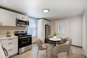 Denver apartment for rent - a kitchen and dining room with a table and chairs