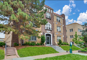 Denver apartment for rent - A brick building with a green lawn in front.