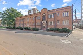 Denver apartment for rent - a large brick building on the corner of a street