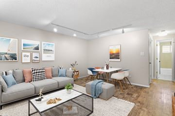 Denver apartment for rent - a living room with a couch and a table
