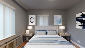 Denver apartment for rent - A bedroom with a large bed and two lamps.