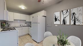 Denver apartment for rent - A kitchen with a table and chairs and a wall of art.