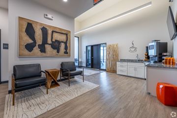 Elkhorn apartment for rent - A modern living room with a large abstract painting on the wall.