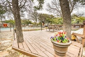 Austin apartment for rent - Wooden deck area with flower planter and picnic tables at Le Montreaux Apartments, Austin, 78759