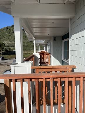 Pismo Beach apartment for rent - a view of a porch with a wooden railing