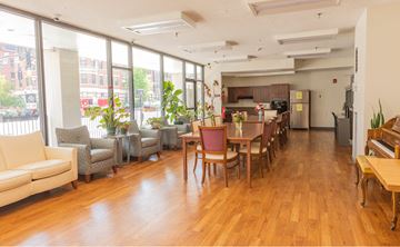 Boston apartment for rent - a large living room with a dining room table and chairs