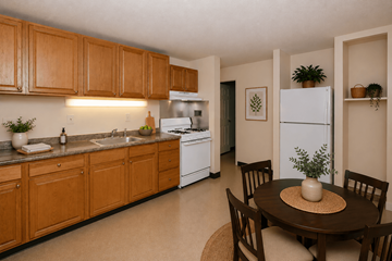 Worcester apartment for rent - A kitchen with wooden cabinets and a white refrigerator.