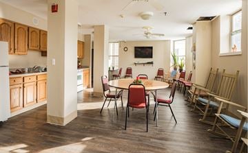 Greenfield apartment for rent - a dining room with a table and chairs and a kitchen