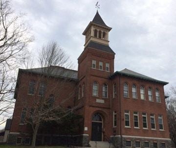 Taunton apartment for rent - a large brick building with a clock tower