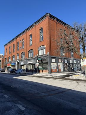 Boston apartment for rent - A red brick building with a tree in front of it.