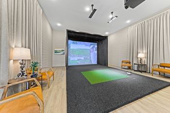 Modern golf simulator in a room