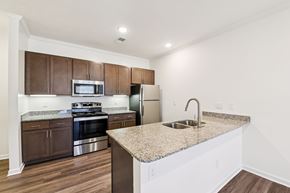 Indian Trail apartment for rent - Kitchen with granite countertops and stainless appliances at Ardmore at the Trail Apartments, Indian Trail, NC