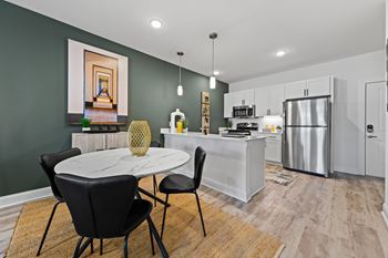 Modern kitchen with dining table set for two