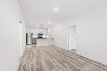 Spacious room with kitchen view