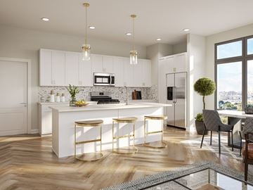 West Hartford apartment for rent - A modern kitchen with white cabinets and a central island.
