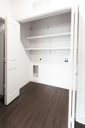 San Antonio apartment for rent - a bedroom with white walls and wood floors and a closet